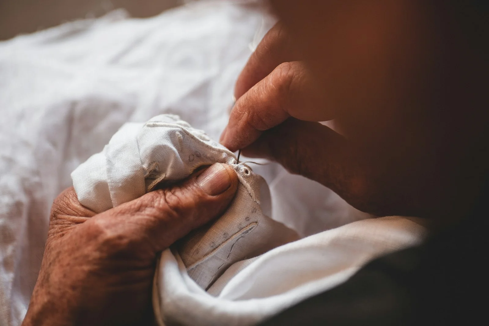 person sewing shirt person sewing shirt
